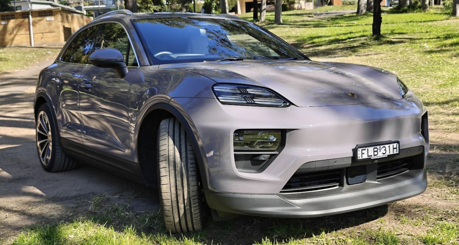 The Porsche Macan electric car parked on grass