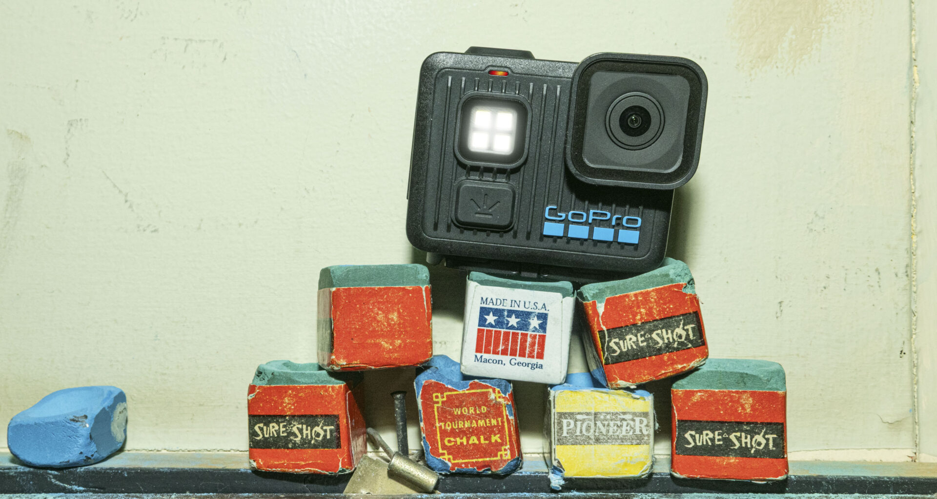 GoPro Lit Hero action cam balancing on bright colored wooden blocks