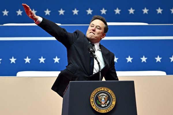 (FILES) Tesla and SpaceX CEO Elon Musk gestures as he speaks during the inaugural parade inside Capitol One Arena, in Washington, DC, on January 20, 2025. Musk's hand gestures at an inauguration event for US President Donald Trump, which quickly drew comparisons to Nazi salutes, appear to have resonated in some far-right extremist spaces online. Several neo-Nazi leaders have shared clips of the viral moment from Musk's Monday speech, in which the billionaire brought his hand to his chest and extended it straight out, twice, before saying: