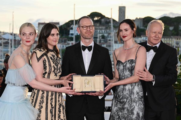 (FILES) Norwegian director and screenwriter Joachim Trier (C) poses with (from L) US actress Elle Fanning, Norwegian actress Inga Ibsdotter Lilleaas, Norwegian actress Renate Reinsve and Swedish actor Stellan Skarsgard during a photocall after winning the Grand Prix for the film