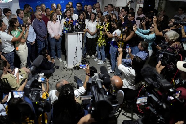 Opposition leader María Corina Machado speaks at a press conference regarding the arrest order for her campaign manager and eight other opposition members for alleged involvement in a conspiracy plot to destabilize the government, in Caracas, Venezuela, Wednesday, March 20, 2024. Machado has been disqualified from holding public office for 15 years but has continued to campaign for president ahead of the July 28 elections. (AP Photo/Ariana Cubillos)