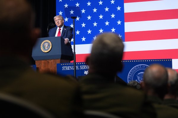 President Donald Trump speaks to a gathering of top U.S. military commanders at Marine Corps Base Quantico, Tuesday, Sept. 30, 2025, in Quantico, Va. (AP Photo/Evan Vucci)