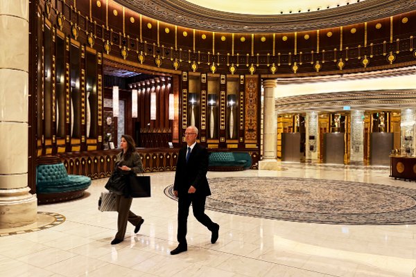 CORRECTS THE IDENTITY OF PERSON ON LEFT - Kirill Dmitriev, the head of the Russian Direct Investment Fund, right, walks with an unidentified member of his team across the Ritz Carlton hotel in Riyadh, Saudi Arabia, Tuesday, Feb. 18, 2025. (AP Photo/Baraa Anwer)