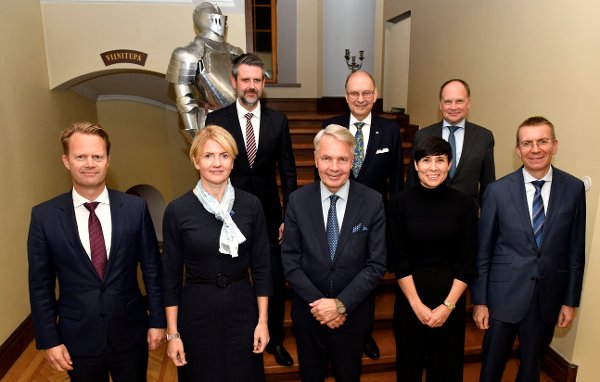 From left, Foreign Minister of Denmark Jeppe Kofod, Foreign Minister of Estonia Eva-Maria Liimets, State Secretary of Iceland Martin Eyjolfsson, Foreign Minister of Finland Pekka Haavisto, State Secretary of Sweden Robert Rydberg, Foreign Minister of Norway Ine Marie Eriksen Soreide, ambassador of Lithuania Giedrius Kazakevicius and Foreign Minister of Latvia Edgars Rinkevics pose for a family photo during the meeting of the foreign ministers of the Nordic countries and the Baltic states, the Nordic-Baltic Eight NB8 group, at the Vanajanlinna castle in Hameenlinna, Finland, Tuesday, Sept. 14, 2021. (Heikki Saukkomaa/Lehtikuva via AP)