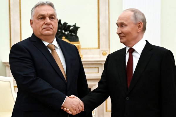 Russian President Vladimir Putin, right, and Hungarian Prime Minister Viktor Orban shake hands during their meeting at the Senate Palace of the Kremlin in Moscow, Russia, Friday, Nov. 28, 2025. (Alexander Nemenov/Pool Photo via AP)