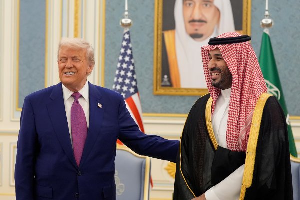 President Donald Trump and Saudi Crown Prince Mohammed bin Salman gesture as they meet delegations at the Royal Palace in Riyadh, Saudi Arabia, Tuesday, May 13, 2025. (AP Photo/Alex Brandon)