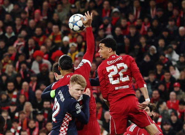 Soccer Football - UEFA Champions League - Liverpool v PSV Eindhoven - Anfield, Liverpool, Britain - November 26, 2025
Liverpool's Virgil van Dijk handles the ball before the referee awards a penalty to PSV Eindhoven REUTERS/Phil Noble