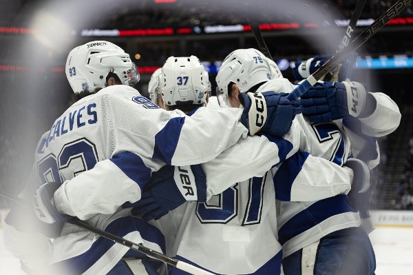 Tampa Bay Lightning players celebrate after a goal against the Utah Mammoth during the first period of an NHL hockey game Sunday, Nov. 2, 2025, in Salt Lake City. (AP Photo/Melissa Majchrzak)
