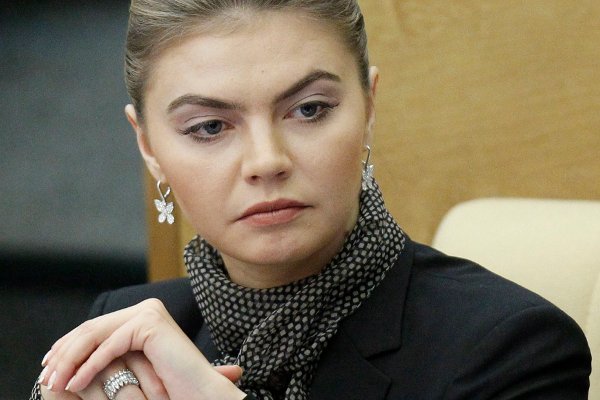 FILE - Alina Kabayeva, a former champion rhythmic gymnast and now a Duma member for the pro-Kremlin United Russia party, attends the first plenary session of the newly-elected State Duma, the lower parliament chamber, Moscow, Russia, Jan. 13, 2012. The Treasury Department said Tuesday, Aug. 2, 2022, that the government has frozen the visa of Kabaeva and imposed other property restrictions. The department said she is also head of a Russian national media company that promotes Russia’s invasion of Ukraine. (AP Photo/Mikhail Metzel, File)