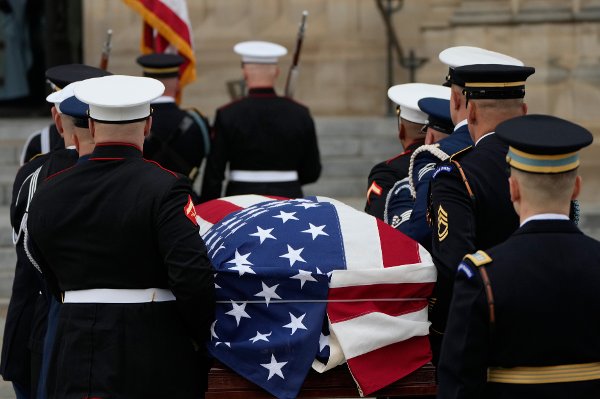 A joint services body bearer team carries the flag-draped casket of former Vice President Dick Cheney into the Washington National Cathedral, Thursday, Nov. 20, 2025, in Washington. (AP Photo/Mark Schiefelbein)