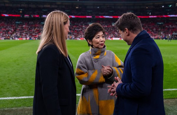 LONDON, ENGLAND - NOVEMBER 30: Michele Kang talks with Cindy Parlow Cone and Mauricio Pochettino of the United States before a game between England and the USWNT at Wembley Stadium on November 30, 2024 in London, England. (Photo by Brad Smith/ISI Photos/USSF/Getty Images for USSF)