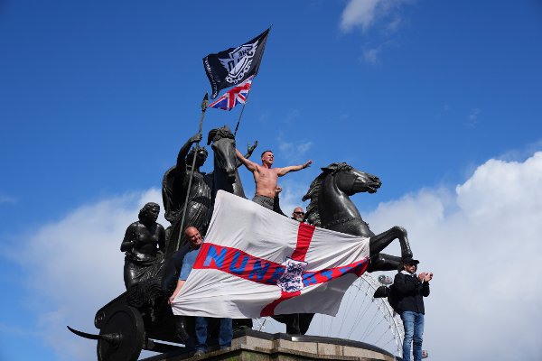 People demonstrate during the Tommy Robinson-led Unite the Kingdom march and rally in London, Saturday, Sept. 13, 2025. (AP Photo/Joanna Chan)