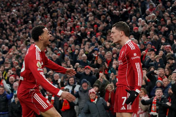 Liverpool's Florian Wirtz, right, celebrates with Liverpool's Hugo Ekitike after scoring his side's second goal during the English Premier League soccer match between Liverpool and Wolverhampton Wanderers in Liverpool, Sunday, Dec. 27, 2025. (AP Photo/Ian Hodgson)