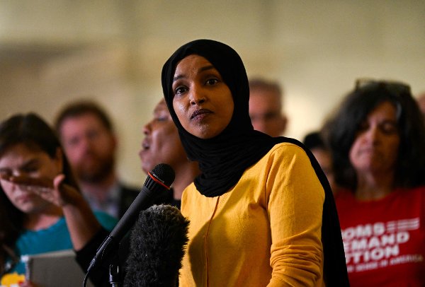 MINNEAPOLIS, MINNESOTA - AUGUST 28: U.S. Rep. Ilhan Omar (D-MN) (C) speaks during a press conference at City Hall following a mass shooting at Annunciation Catholic School on August 28, 2025 in Minneapolis, Minnesota. According to Minneapolis Police, a gunman fired through the windows of the Annunciation Church at worshippers sitting in pews during a Catholic school Mass, killing two children and injuring at least 17 others. The gunman reportedly died at the scene from a self-inflicted gunshot wound. Stephen Maturen/Getty Images/AFP (Photo by Stephen Maturen / GETTY IMAGES NORTH AMERICA / Getty Images via AFP)