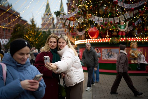 Women pose for a selfie in front of a Christmas tree at the Christmas fair opened at Manezhnaya square near Red Square in Moscow, Wednesday, Dec. 3, 2025. (AP Photo/Alexander Zemlianichenko)
webwe
