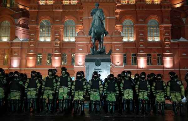 Servicemen of the Russian National Guard (Rosgvardia) gather at the Red Square to prevent a protest rally in Moscow, Russia, Tuesday, Feb. 2, 2021. A Moscow court has ordered Russian opposition leader Alexei Navalny to prison for more than 2 1/2 years on charges that he violated the terms of his probation while he was recuperating in Germany from nerve-agent poisoning. Navalny, who is the most prominent critic of President Vladimir Putin, had earlier denounced the proceedings as a vain attempt by the Kremlin to scare millions of Russians into submission. (AP Photo/Pavel Golovkin)