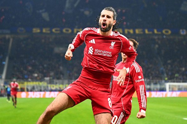 Liverpool's Hungarian midfielder #08 Dominik Szoboszlai celebrates scoring a penalty kick during the UEFA Champions League phase day 6 football match between Inter Milan and Liverpool at San Siro stadium in Milan, on December 9, 2025. (Photo by Stefano RELLANDINI / AFP)
