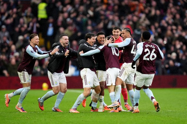 Aston Villa's Emi Buendia (fourth right) is mobbed by his team mates after scoring his sides second goal during the Premier League match at Villa Park, Birmingham. Picture date: Saturday December 6, 2025.