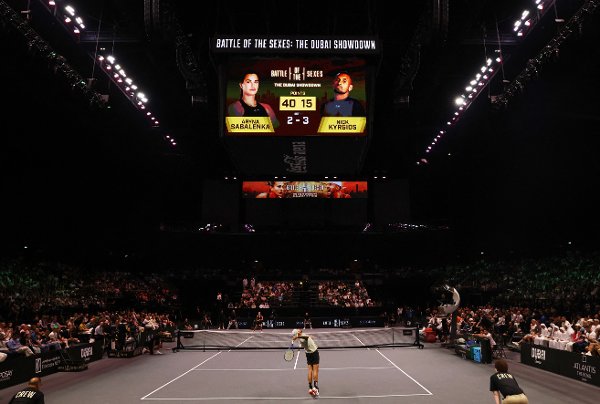 Nick Kyrgios serves against Aryna Sabalenka during their Battle of the Sexes match in Dubai, United Arab Emirates, Sunday Dec. 28, 2025. (Amr Alfiky/Pool Photo via AP)