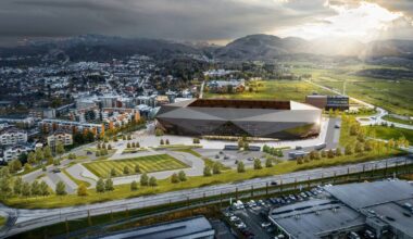 Et flyfoto av en by (Bildebeskrivelsen er laget av en KI-tjeneste)