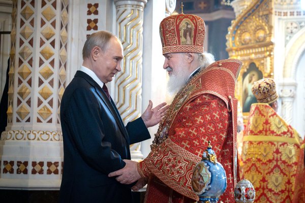 Russian President Vladimir Putin, left, and Russian Orthodox Church Patriarch Kirill congratulate each other after an Orthodox Easter service at the Christ the Savior Cathedral in Moscow, Russia, on Sunday, April 20, 2025. (Oleg Varov/Russian Orthodox Church Press Service via AP)
