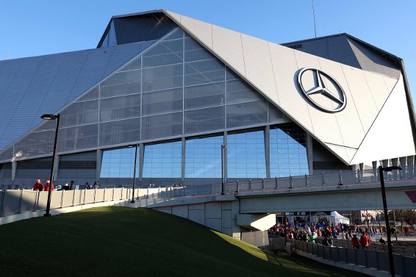 ATLANTA, GEORGIA - JANUARY 20: Fans gather outside of the stadium prior to the 2025 CFP National Championship between the Ohio State Buckeyes and the Notre Dame Fighting Irish at the Mercedes-Benz Stadium on January 20, 2025 in Atlanta, Georgia.   Jamie Squire/Getty Images/AFP (Photo by JAMIE SQUIRE / GETTY IMAGES NORTH AMERICA / Getty Images via AFP)