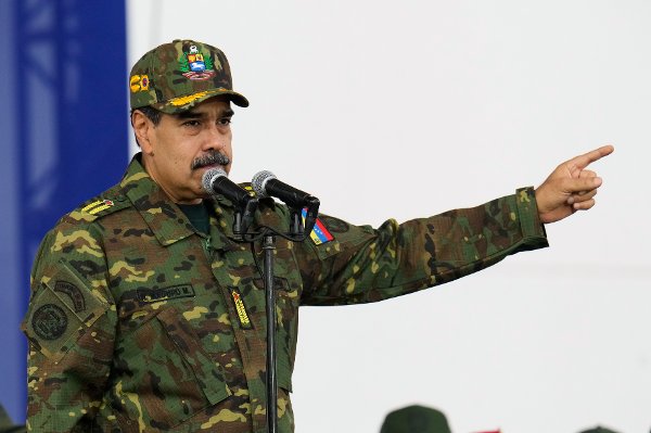 Venezuelan President Nicolas Maduro speaks during a government-organized civic-military rally in Caracas, Venezuela, Tuesday, Nov. 25, 2025. (AP Photo/Ariana Cubillos)