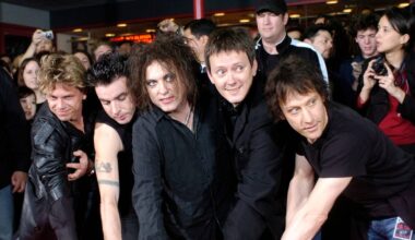 (l-r) Jason Cooper, Simon Gallup, Robert Smith, Roger O'Donnell and Perry Bamonte of British rock group The Cure put their hands in cement at Hollywood's Rockwalk in Los Angeles, Friday, April 30, 2004. Formed in 1976 by frontman Smith, The Cure has sold more than 28 million albums worldwide. (AP Photo/Chris Pizzello)