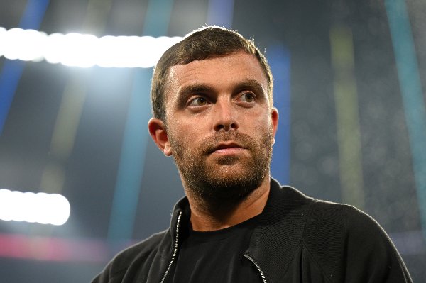 MUNICH, GERMANY - MAY 31: Former professional footballer and current Sport Writer Fabrizio Romano looks on during the UEFA Champions League Final 2025 between Paris Saint-Germain and FC Internazionale Milano at Munich Football Arena on May 31, 2025 in Munich, Germany. (Photo by Michael Regan - UEFA/UEFA via Getty Images)