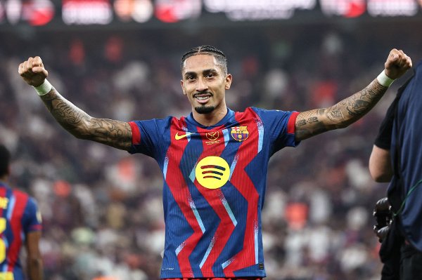 Barcelona's Brazilian forward #11 Raphinha celebrates after scoring his team's first goal during the Spanish Super Cup final football match between FC Barcelona and Real Madrid at the King Abdullah Stadium in Jeddah on January 11, 2026. (Photo by Fadel SENNA / AFP)
