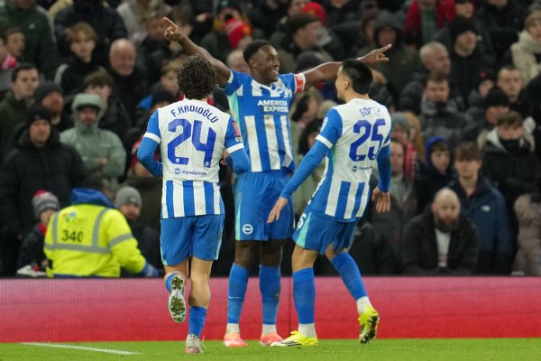 Brighton's Danny Welbeck celebrates after scoring during the FA Cup third round soccer match between Manchester United and Brighton in Manchester, England, Sunday, Jan. 11, 2026. (AP Photo/Jon Super)