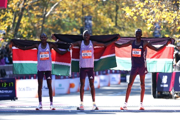 NEW YORK, NEW YORK - NOVEMBER 02: (L-R) Alexander Mutiso of Kenya, Benson Kipruto of Kenya and Albert Korir of Kenya pose for a photo after placing in the Professional Men’s Open Division during the 2025 TCS New York City Marathon on November 02, 2025 in New York City.   Ishika Samant/Getty Images/AFP (Photo by Ishika Samant / GETTY IMAGES NORTH AMERICA / Getty Images via AFP)