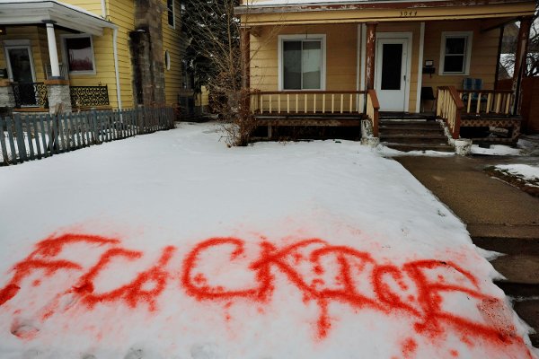A message opposing U.S. Immigration and Customs Enforcement (ICE) is painted in the snow in front of a house, a day after the fatal shooting of Renee Nicole Good by an ICE agent, in Minneapolis, Minnesota, U.S., January 8, 2026.   REUTERS/Brian Snyder