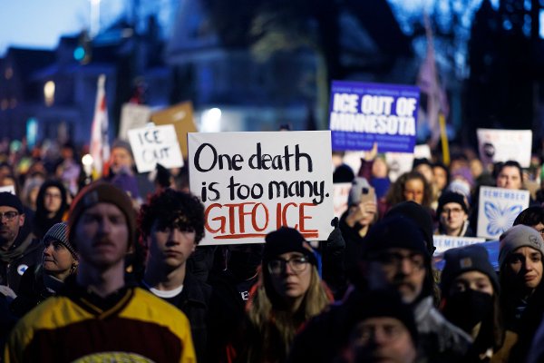 People demonstrate against ICE during a vigil at the site where a woman was shot and killed by an immigration officer earlier in the day in Minneapolis, Minnesota, on January 7, 2026. An immigration officer in Minneapolis shot dead a woman Wednesday, triggering outrage from local leaders even as US President Donald Trump claimed the officer acted in self-defense. Minneapolis Mayor Jacob Frey deemed the government's allegation that the woman was attacking federal agents 
