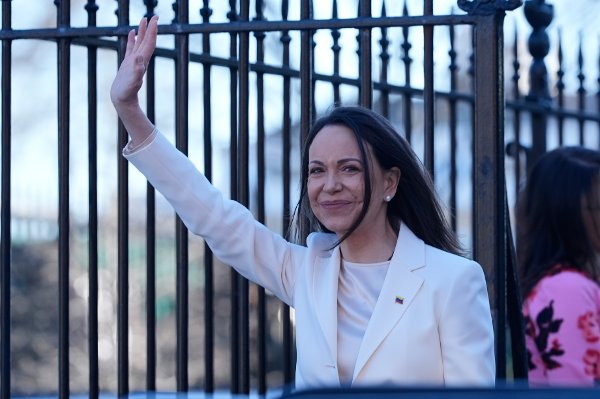 Venezuelan opposition leader María Corina Machado waves to supporters on Pennsylvania Avenue as she leaves the White House after meeting with President Donald Trump Thursday, Jan. 15, 2026, in Washington. (AP Photo/Pablo Martinez Monsivais)
