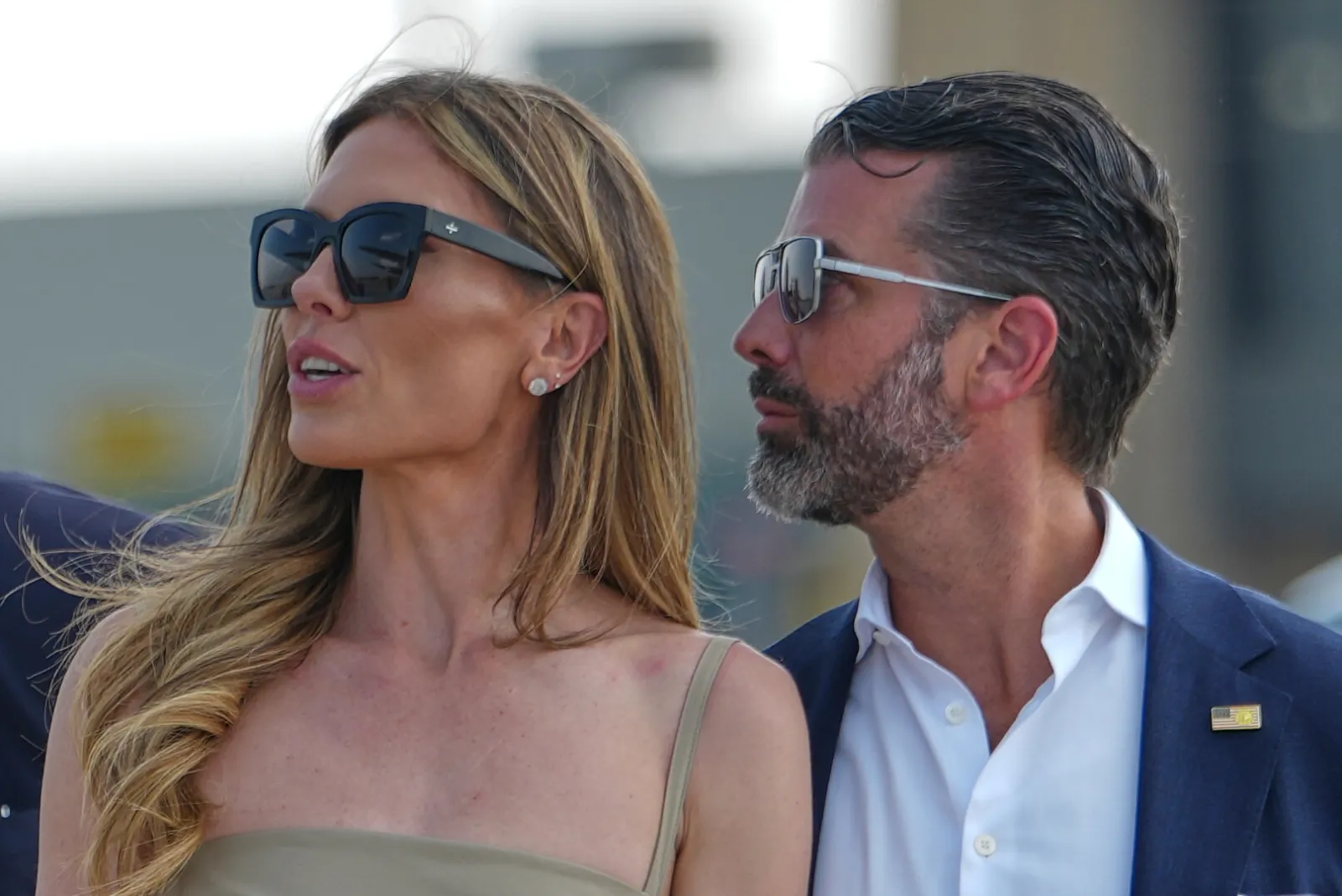 Donald Trump Jr. and wife Bettina Trump wait to board Air Force One at Bismarck Municipal Airport on July 1, 2026.