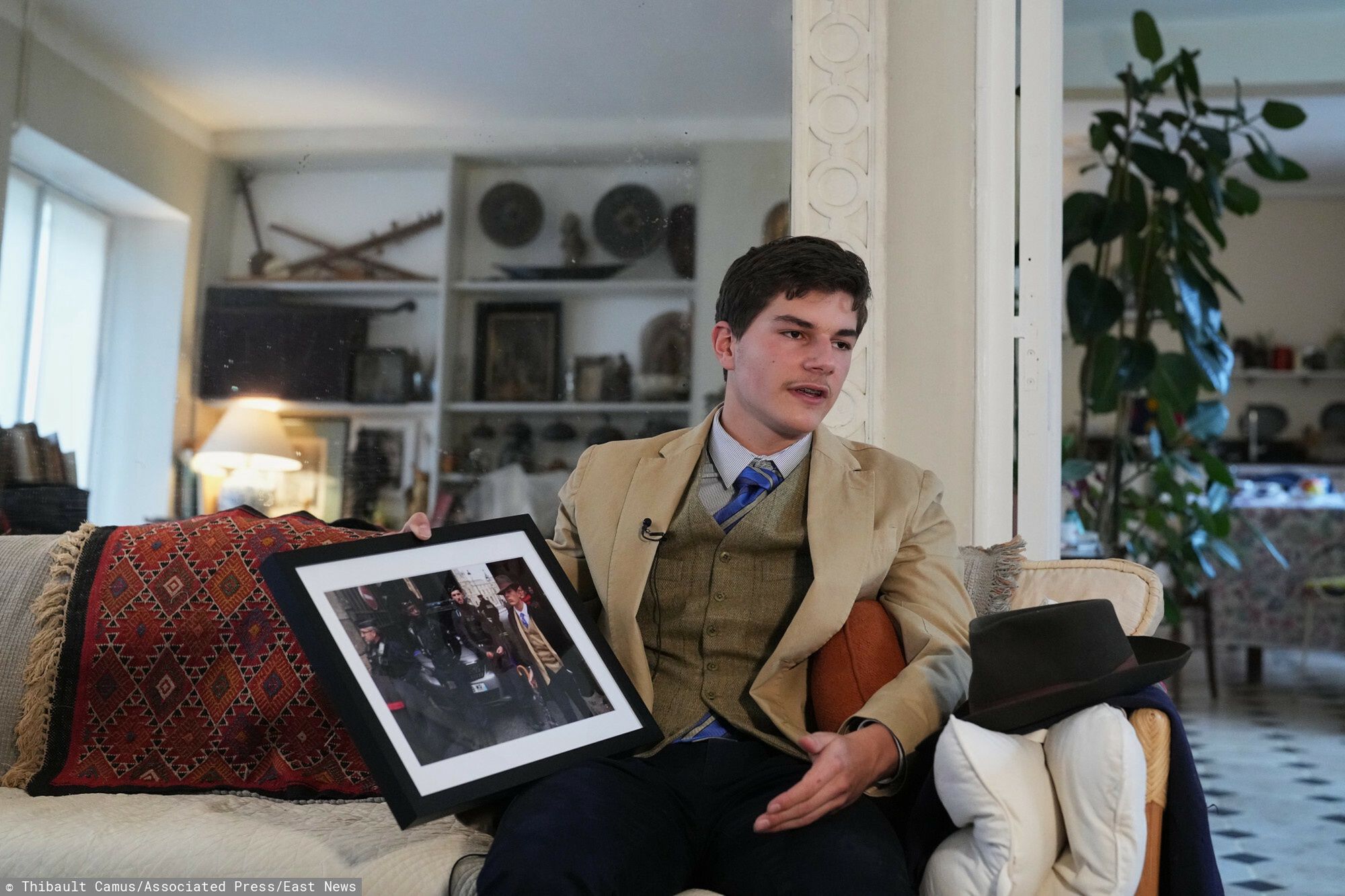 TemporaryPedro Elias Garzon Delvaux holds an Associated Press photo of him outside the Louvre on the day of the crown jewels heist, during an interview with Associated Press, Saturday, Nov. 8, 2025, in Rambouillet, south of Paris. (AP Photo/Thibault Camus)Thibault Camus