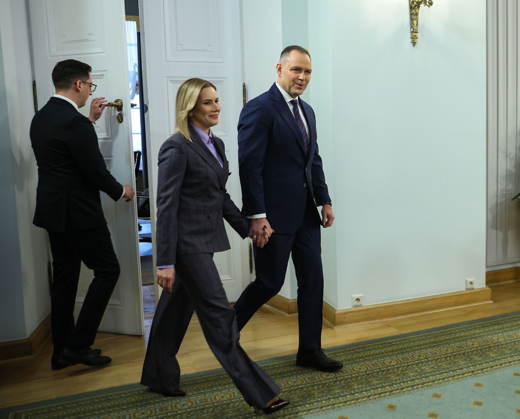 Warszawa, 14.01.2026. Prezydent RP Karol Nawrocki (P) i pierwsza dama Marta Nawrocka (C) na spotkaniu noworocznym z przedstawicielami kościołów i związków wyznaniowych oraz mniejszości narodowych i etnicznych w Polsce, 14 bm. w Pałacu Prezydenckim w Warszawie. (sko) PAP/Leszek Szymański