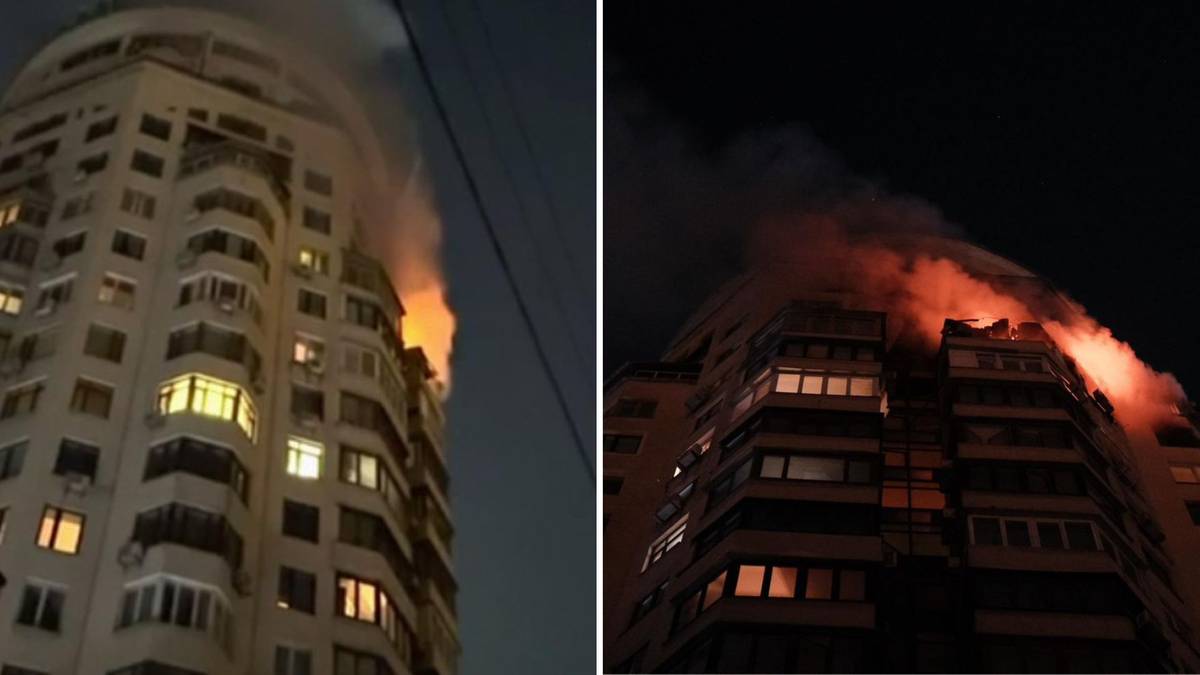 Płonący wieżowiec w nocy, widoczne płomienie i dym wydobywające się z okien.