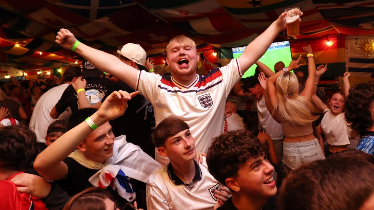 England supporters celebrate during the World Cup soccer match between England and Croatia at The Clock pub in Hebburn, England, Wednesday, June 17, 2026. (AP Photo/Scott Heppell)