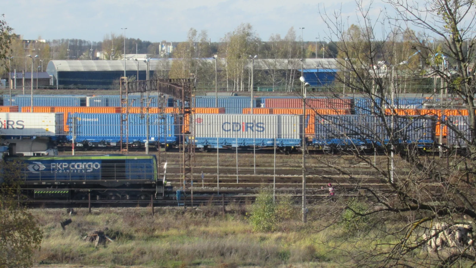 Freight tracks, containers and a PKP Cargo locomotive at Małaszewicze freight station in Poland