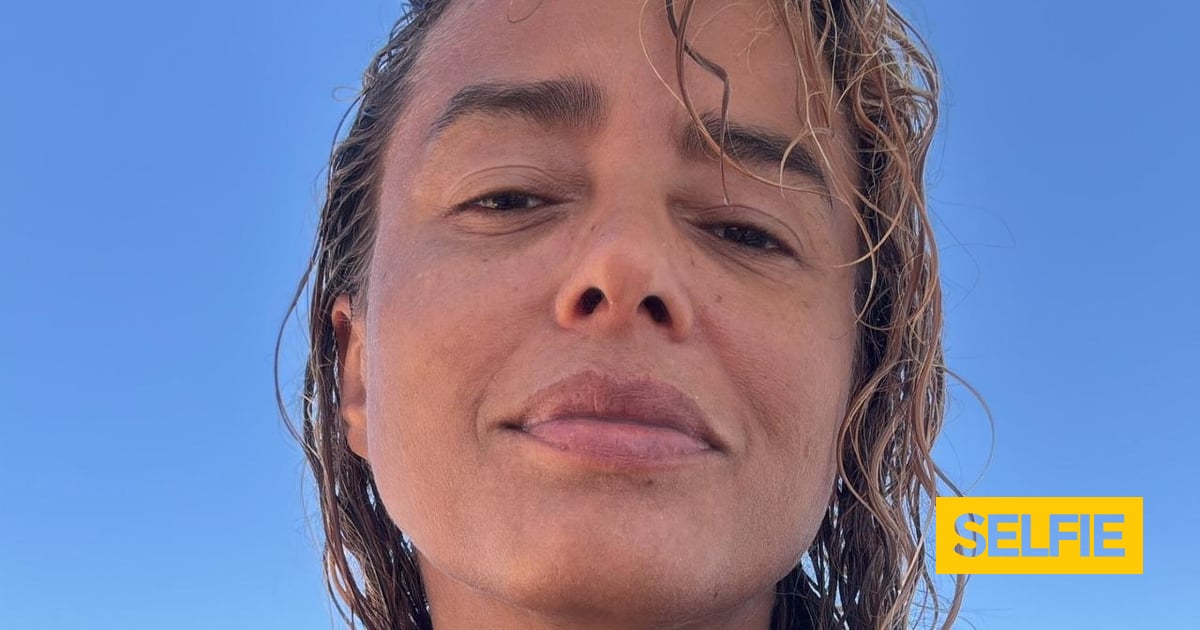 Na praia, Liliana Almeida surge cúmplice de homem especial