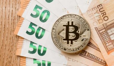 Bitcoin por cima de notas de 50 euros