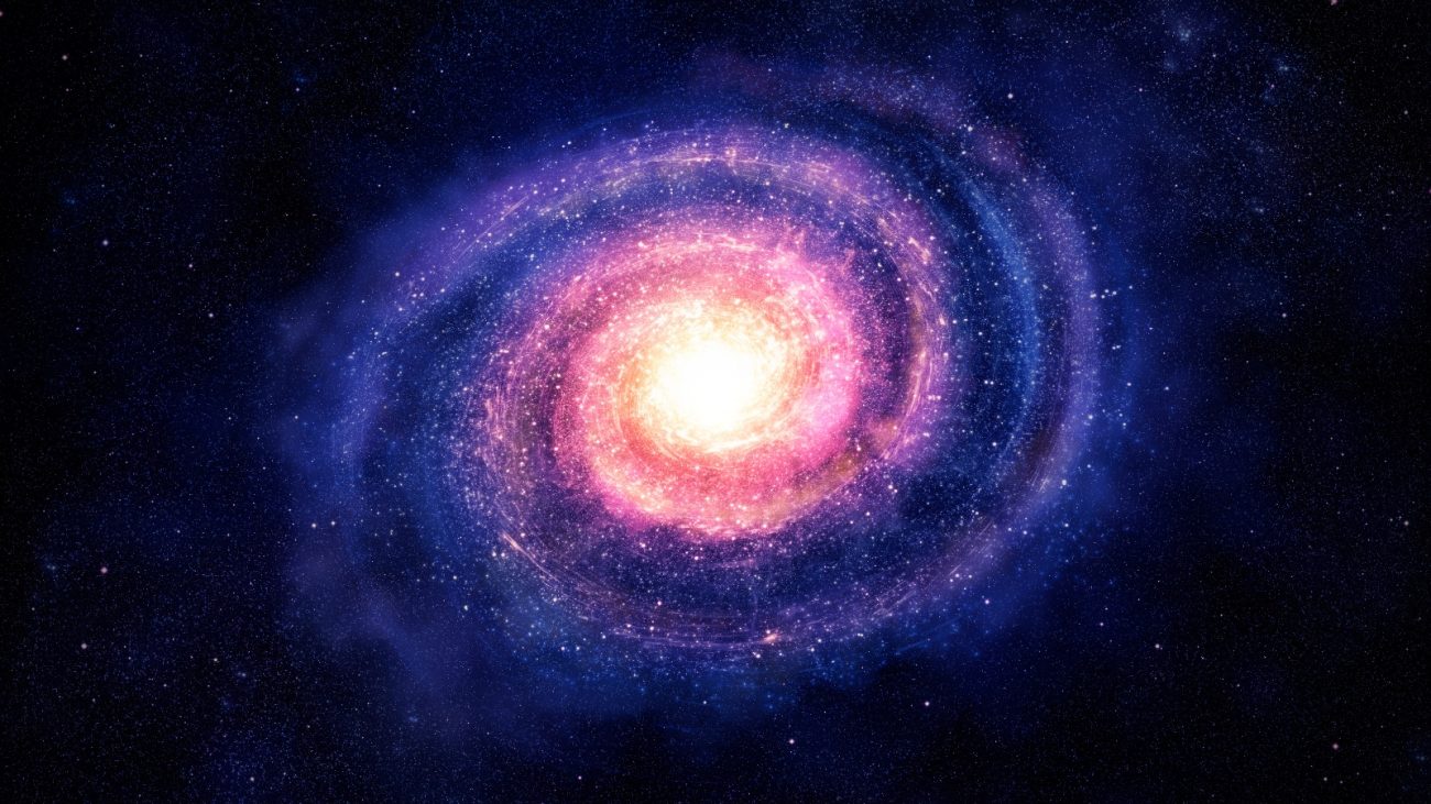 Imagem de uma galáxia vibrante no espaço, exibindo cores brilhantes de rosa, roxo e branco, representando o universo e objetos celestes.