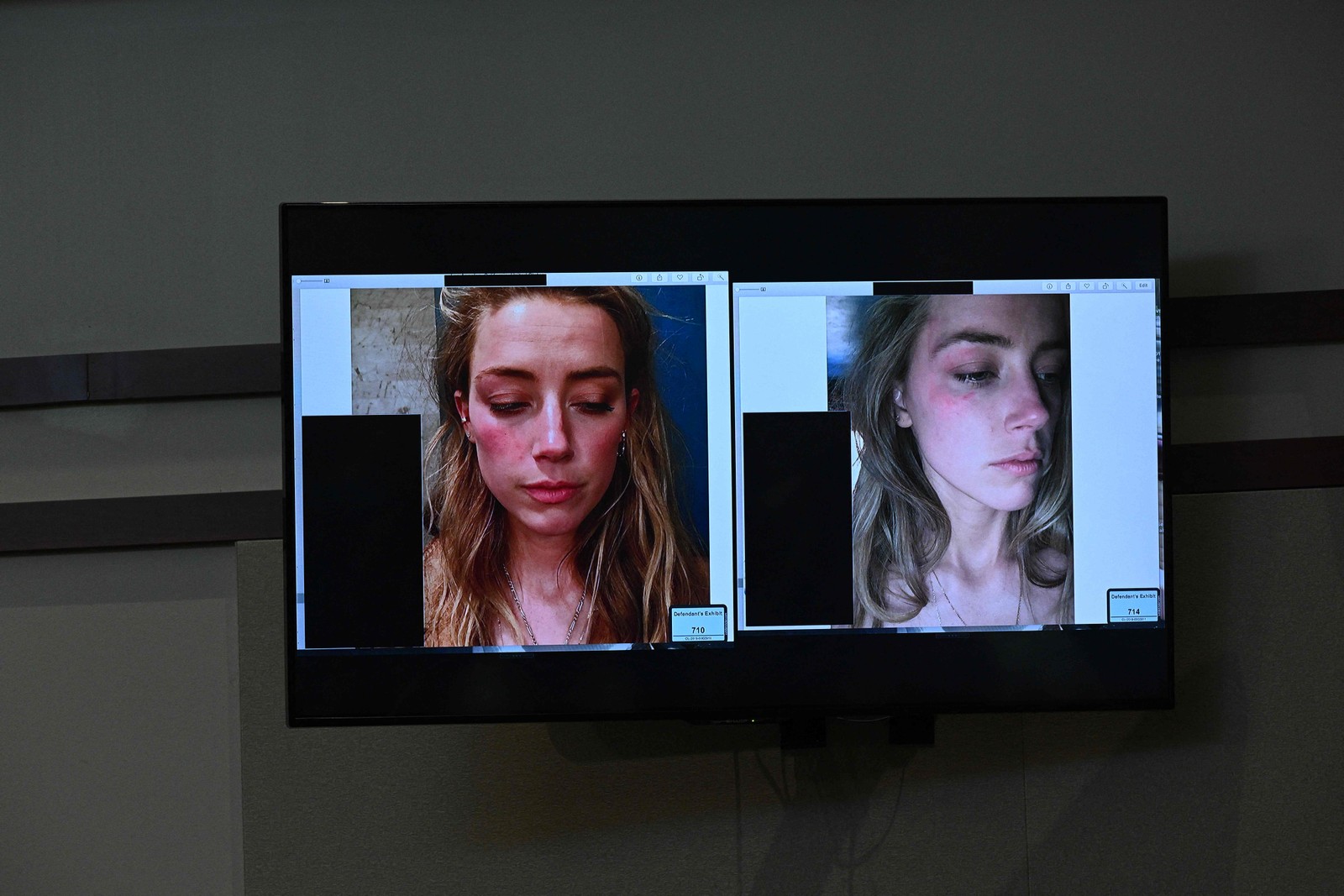 Fotos de Amber Heard aparecem em uma tela durante o julgamento por difamação de Johnny Depp contra ela no Tribunal de Justiça do Condado de Fairfax, na Virgínia, EUA, em 17 de maio de 2022 — Foto: BRENDAN SMIALOWSKI / AFP