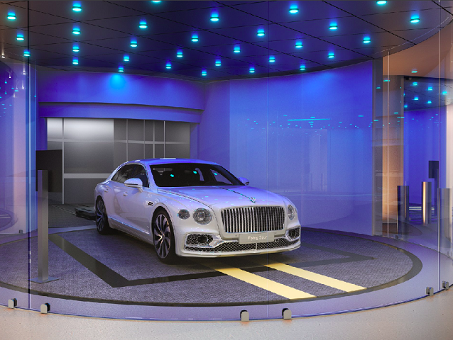 Esse equipamento pode mover o carro para cima ou para baixo até o andar desejado.  Os andares mais baixos do poço do elevador têm janelas de vidro, permitindo que os passageiros tenham uma visão ampla das áreas compartilhadas do prédio.-Divulgação bentley residences13