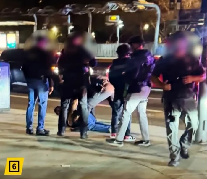 Nick a fost imobilizat la pământ și încătușat. FOTO: captură X/@CubanOnlyTrump