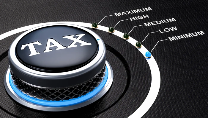 Buton pe care scrie TAX