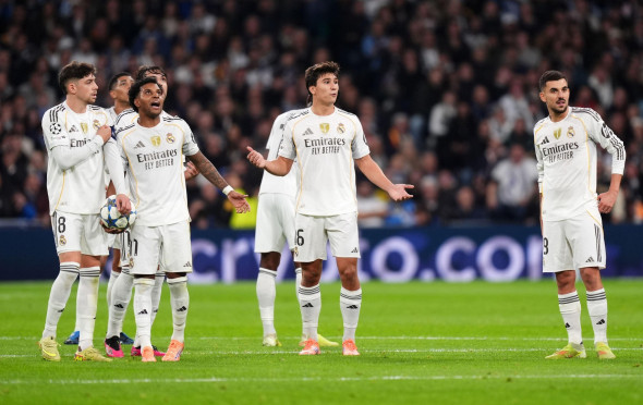 (left to right) Real Madrid's Federico Valverde, Rodrygo, Gonzalo Garcia and Dani Ceballos appear dejected after Manchester City score their first goal during the UEFA Champions League match at the Bernabeu in Madrid, Spain. Picture date: Wednesday Decemb