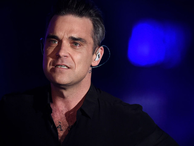 Robbie Williams, confesiuni dureroase din perioada Take That: „Eram atât de deprimat încât dădeam pe gât o sticlă de vodcă!”